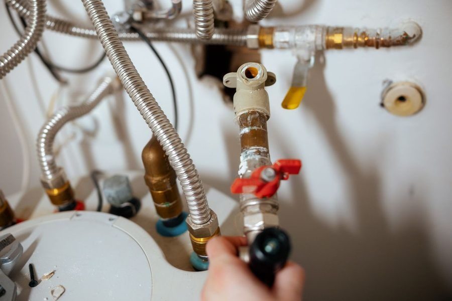 plumber fixing gas lines in a home