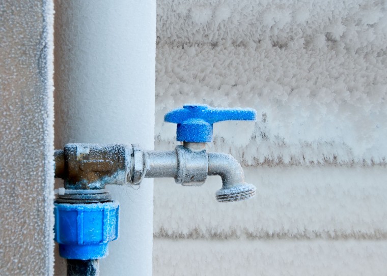 Frozen water pipe with frost on it. 