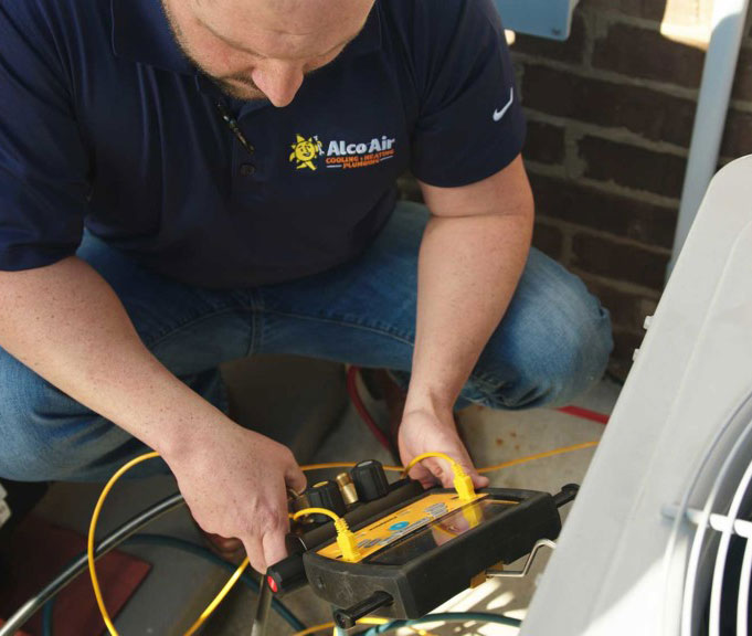 service-area-company tech servicing a ac unit